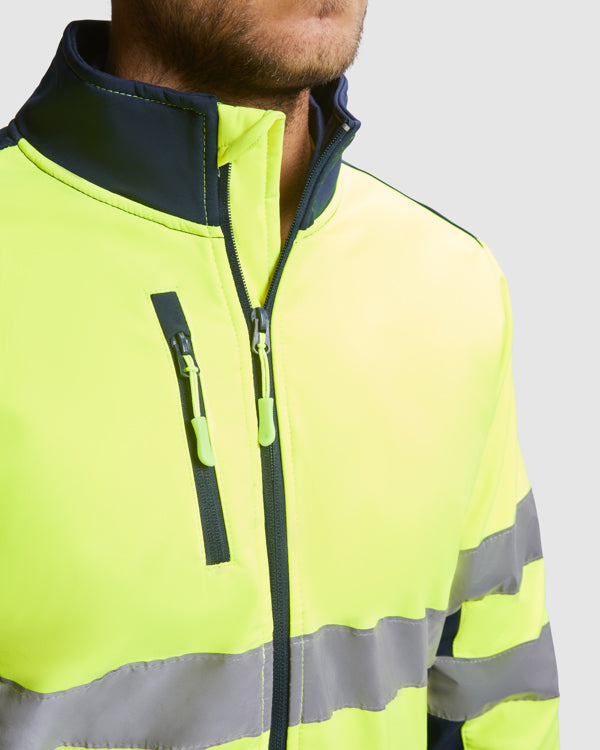 AV SOFTSHELL ANTARES T/S PLOMO/AMARILLO FLUOR
